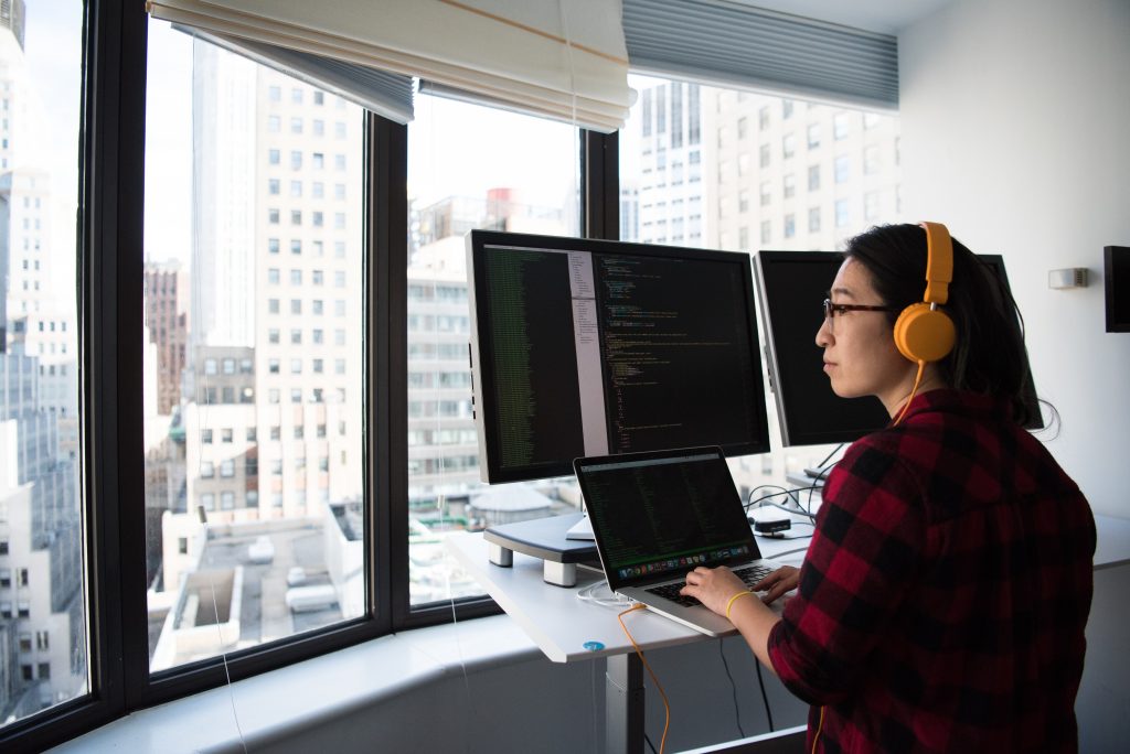 woman sitting in front of computer